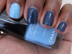 chanel coco blue and blue rebel nail polish on fingers